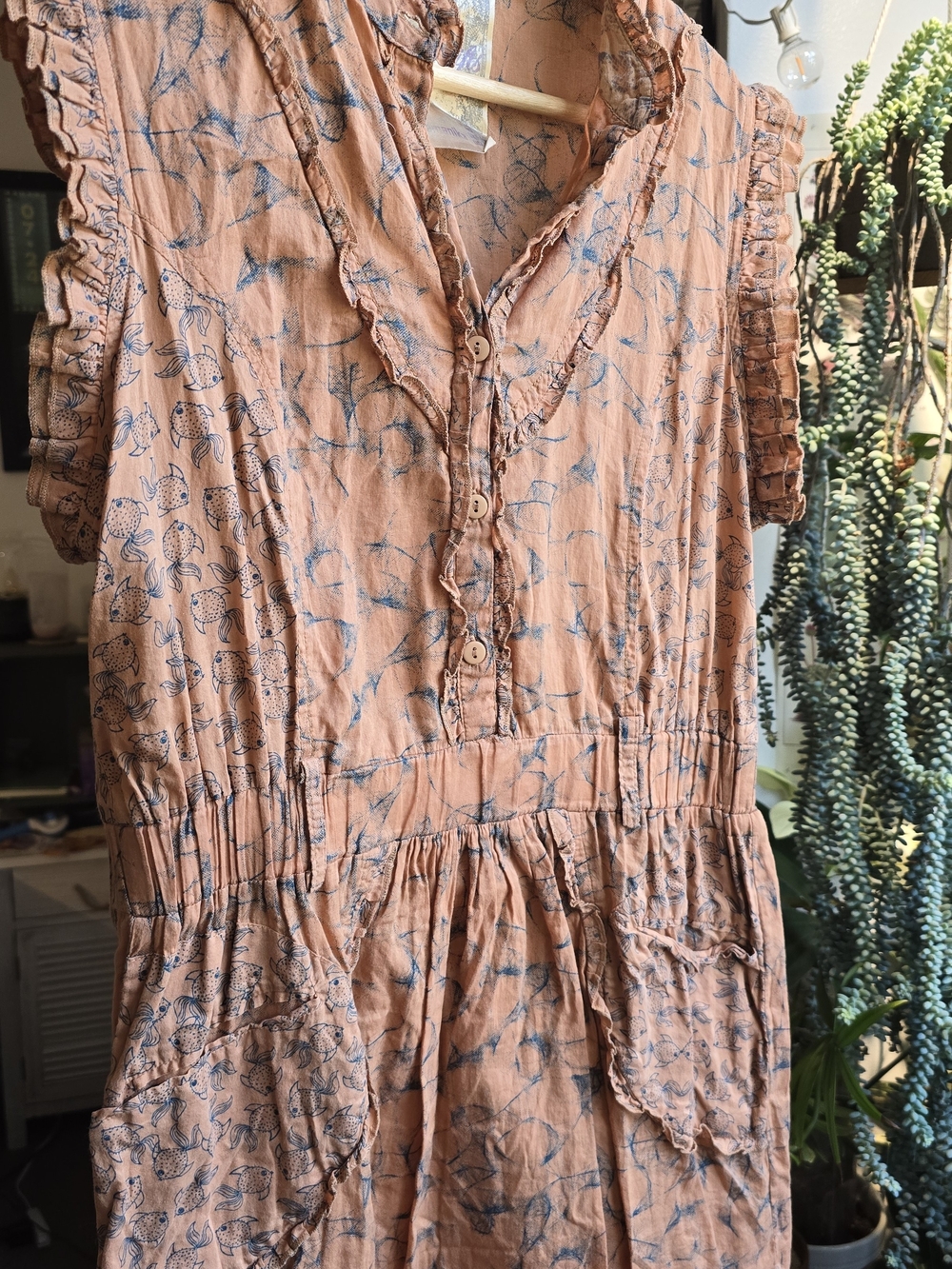 Sleeveless Peach Floral Mini Dress with Button-Front and Ruffle Trim